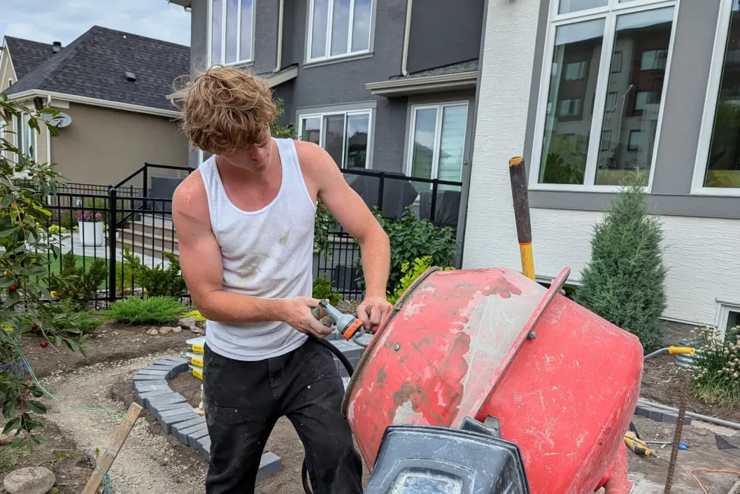 Cement mixer in action on a Calgary landscaping build site by All The Moore