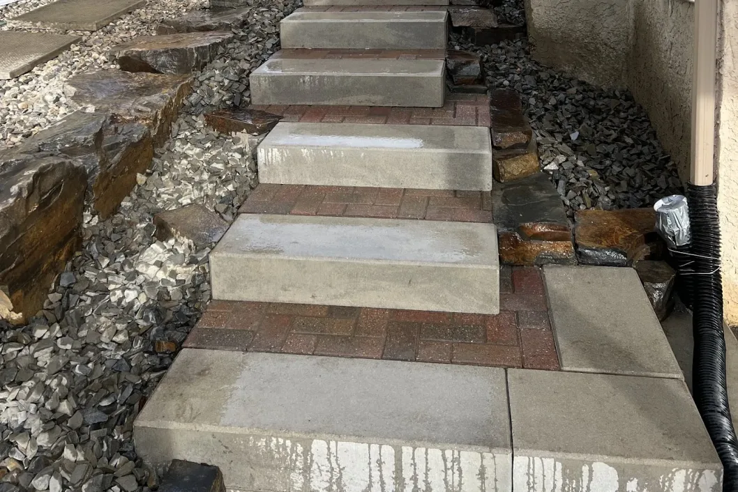 Paver step risers with rock landscaping detail, Calgary hardscaping by All The Moore